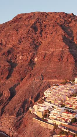 coastal town on the volcanic slopes of tenerife at sunset