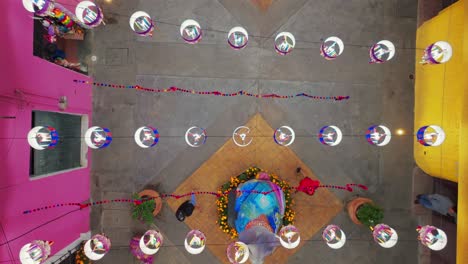 colorful overhead decorations and el conejo statue on benito juarez street in tuxpan, jalisco, mexico