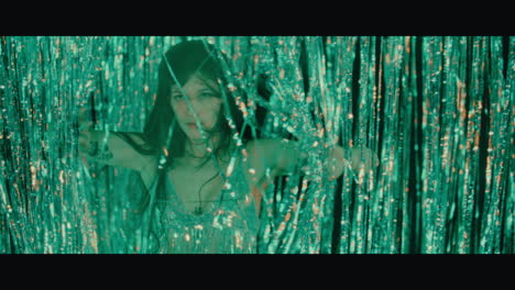 woman dancing under glittery lights