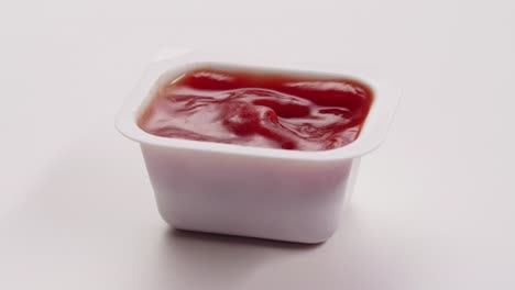 tomato sauce in a plastic container