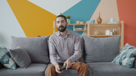 Man Playing Video Games on Couch