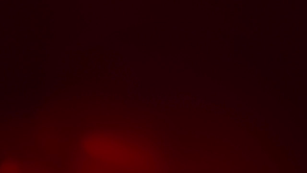 Red Light Flare Effect in Dark. Real Optical Flare Animation