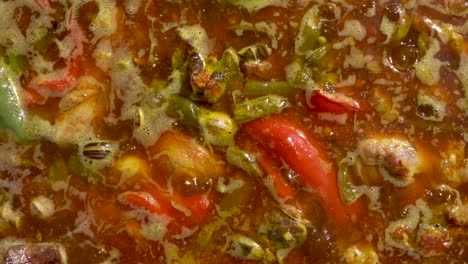 aerial traveling of a paella while it boils