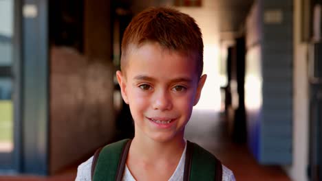 Portrait-of-cute-schoolboy-standing-with-backpack-4k