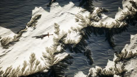 helicopter-above-mountains-in-snow