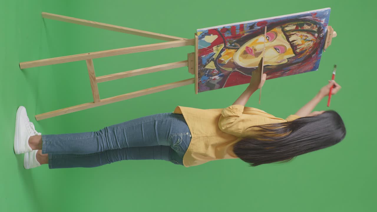 Woman Painting a Portrait on an Easel