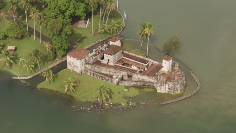 side panning shot of medieval castle san felipe at guatemala, aerial