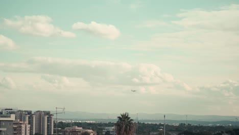 beautiful shot over the city, flying airplane above israel tel aviv, was shot from the roof, middle east, colorful surfing clouds, golden hour, cityscape, sony 4k video