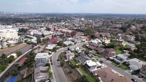 aerial view above divide between residential districts of baldwin hills and crenshaw neighborhoods, los angeles, california