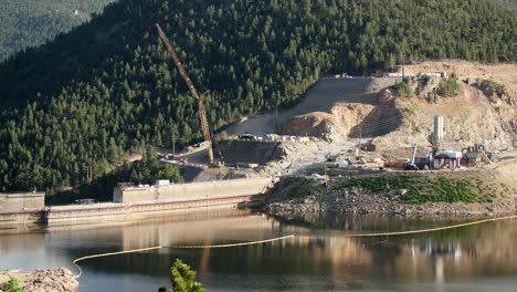 A-construction-crane-working-on-the-dam-at-Gross-Reservoir-in-Boulder-County,-Colorado,-USA