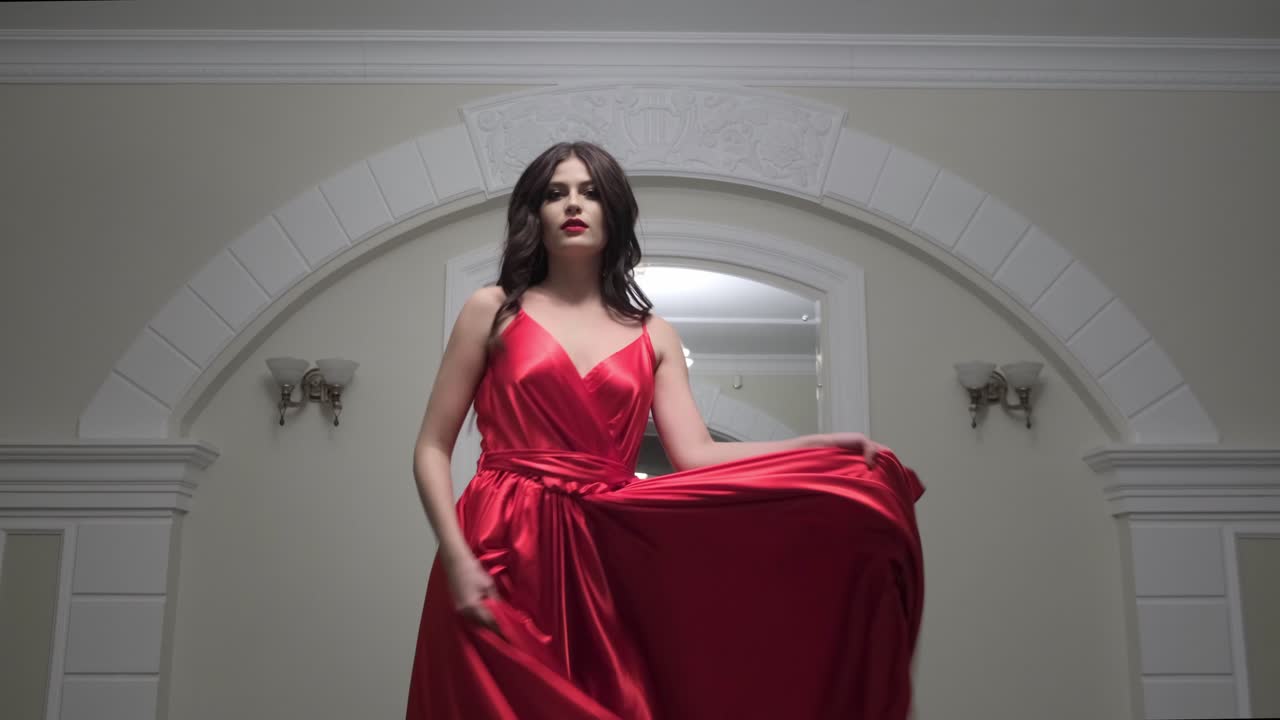Woman in Red Ball Gown in an Elegant Setting