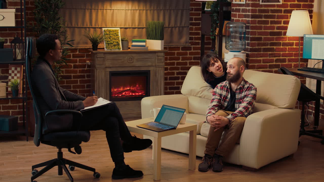 Psychotherapist consulting married couple at therapy session