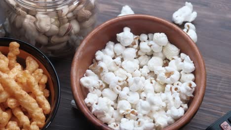 snacks and popcorn on a table