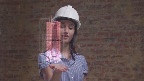 animation of 3d interactive model of city spinning over hand of female architect