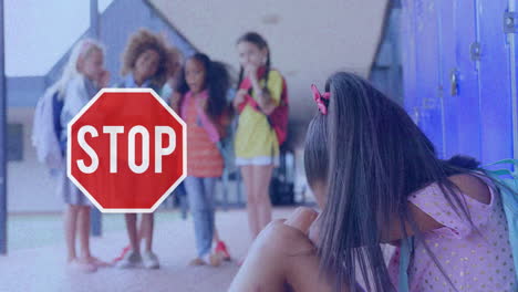 señal de parada y niña llorando en la escuela contra el fondo parpadeante