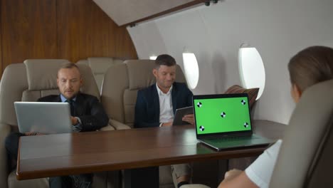 business people have meeting in corporate jet