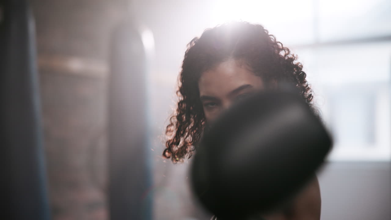 A woman boxing in a gym