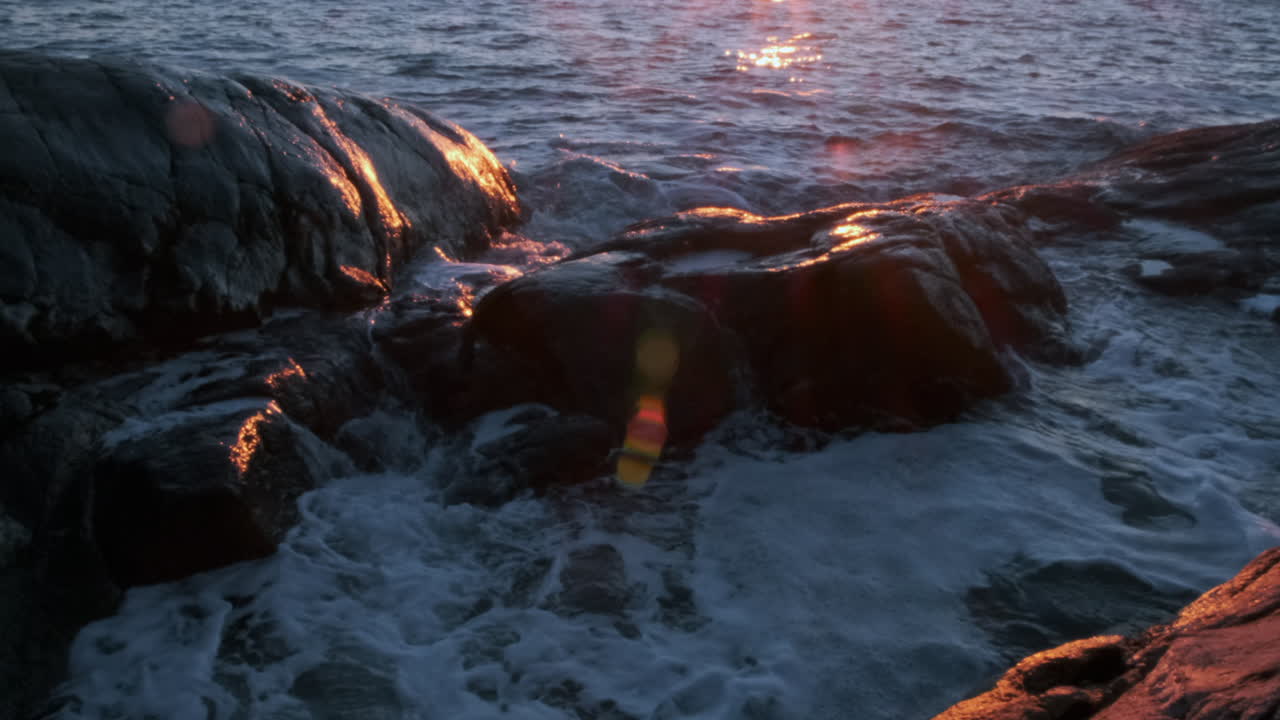 Mysterious Dark Ocean Rippling At Beautiful Golden Sunset Slow motion