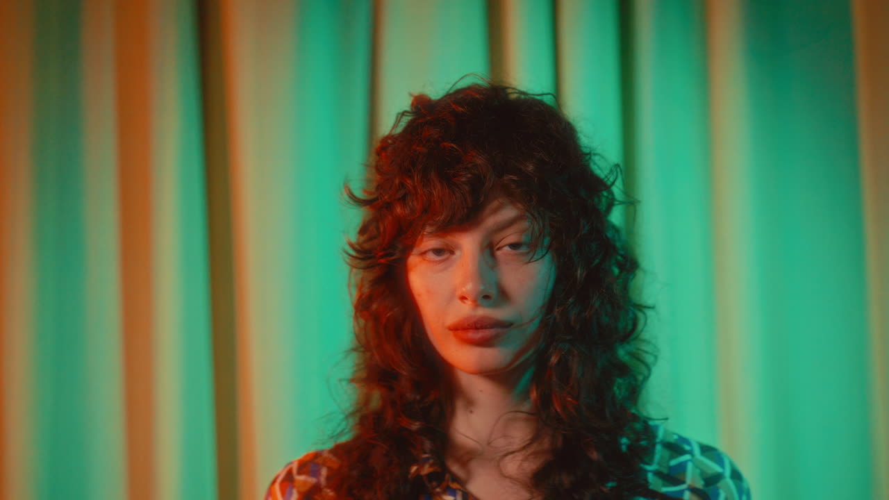 Portrait of Young Beautiful Woman Posing in Retro Lighting