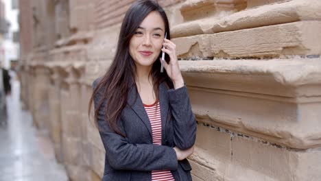 Young-woman-listening-to-a-call-on-her-mobile