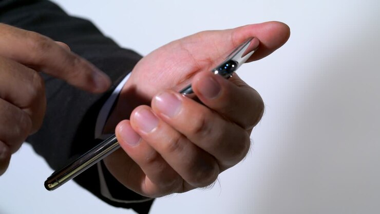 business man touch the smartphone in the office