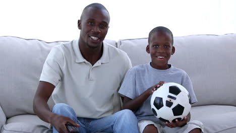 Father-and-his-son-watching-football