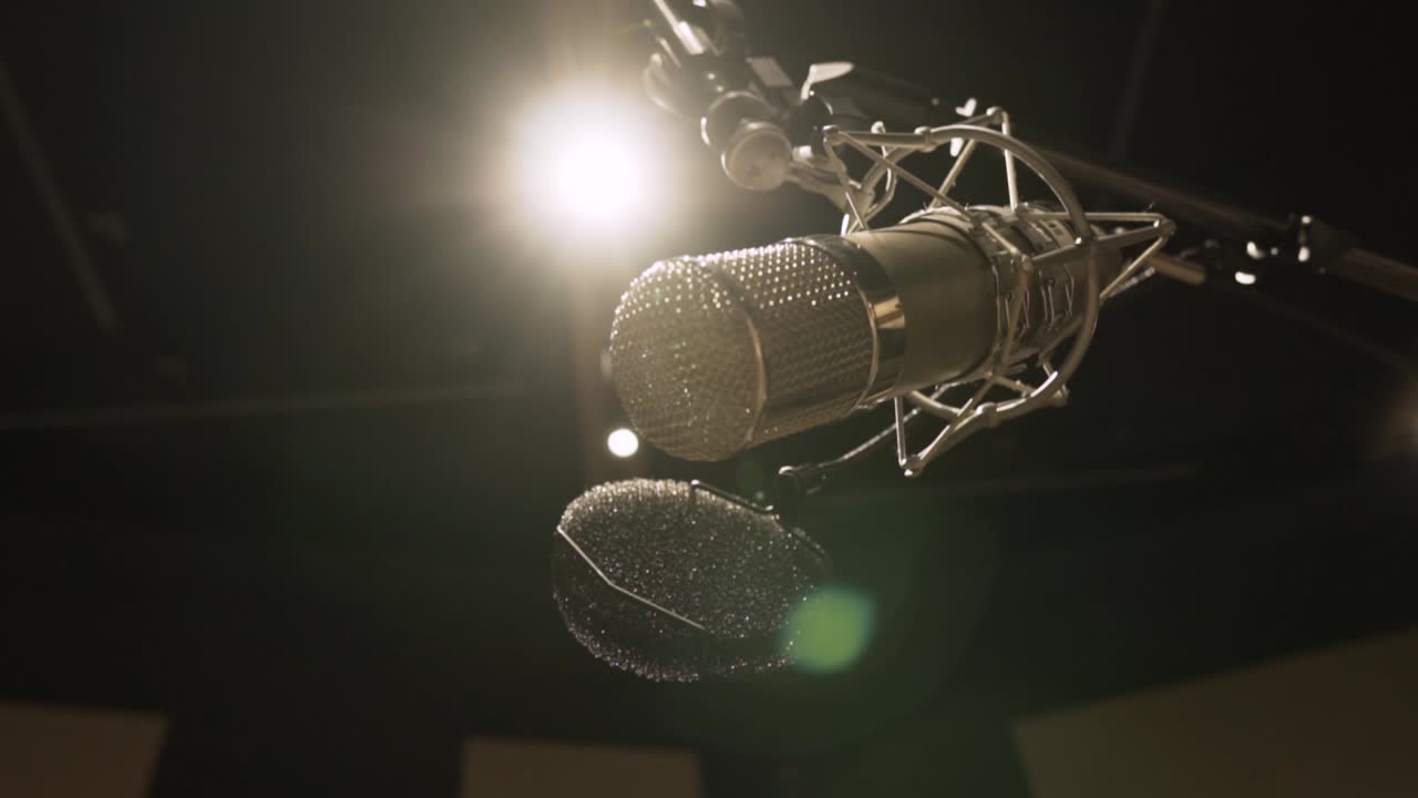 Microphone in a Studio. Suspenden microphone. Golden microfone. low angle shot. flare