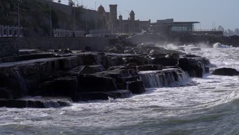 View-of-a-wave-breaking-onto-a-rocky-coast-in-Mar-del-Plata,-Argentina