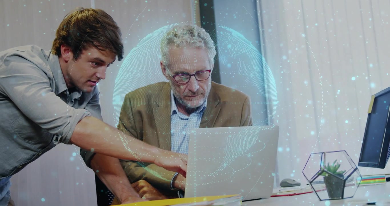 Junior leaning and pointing at laptop keys, causing hologram shifting and updating tech dashboard
