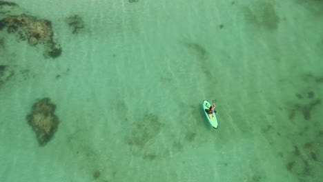 Man-enjoying-surfing-kayaking-in-the-tropical-water-of-Australia