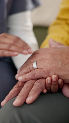 close-up of hands holding, showing care and compassion