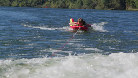 boy wakeboarding on a river