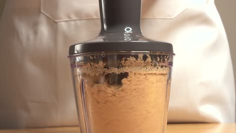 mixing cookies in a mixer to make a vertical panoramic cake base