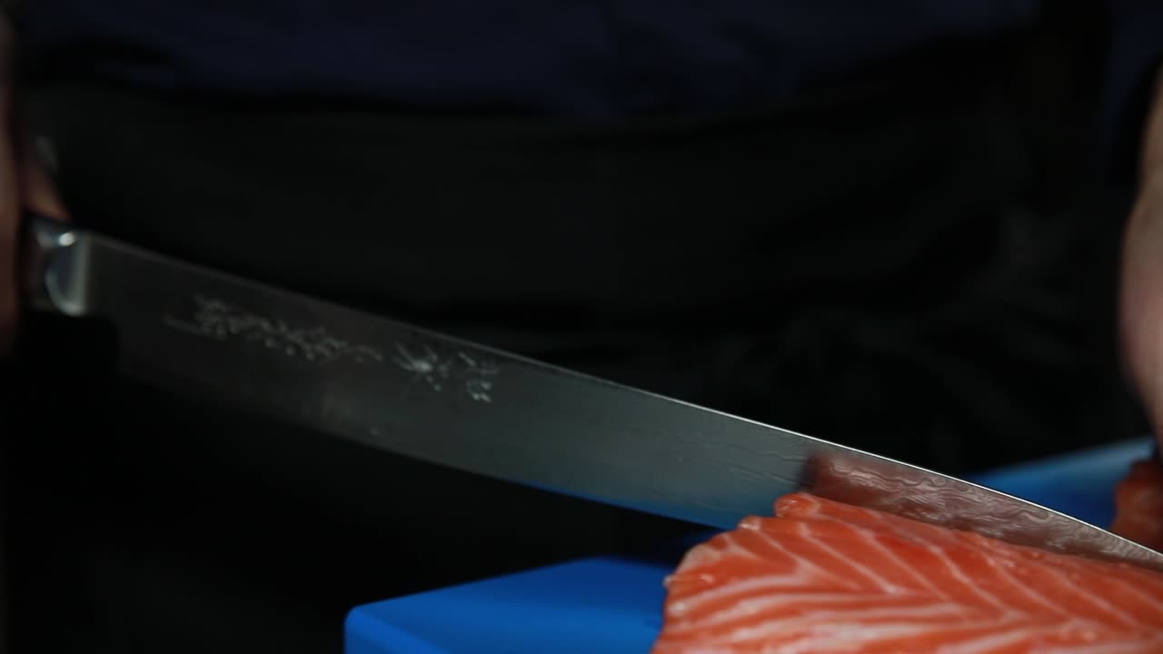Chef preparing salmon sashimi
