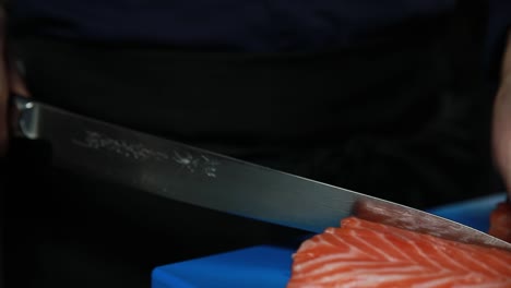 chef preparing salmon sashimi