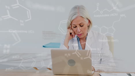 animation of medical data processing over stressed caucasian female doctor using laptop at hospital