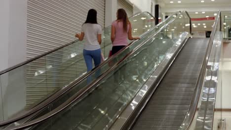 friends on the escalator in mall