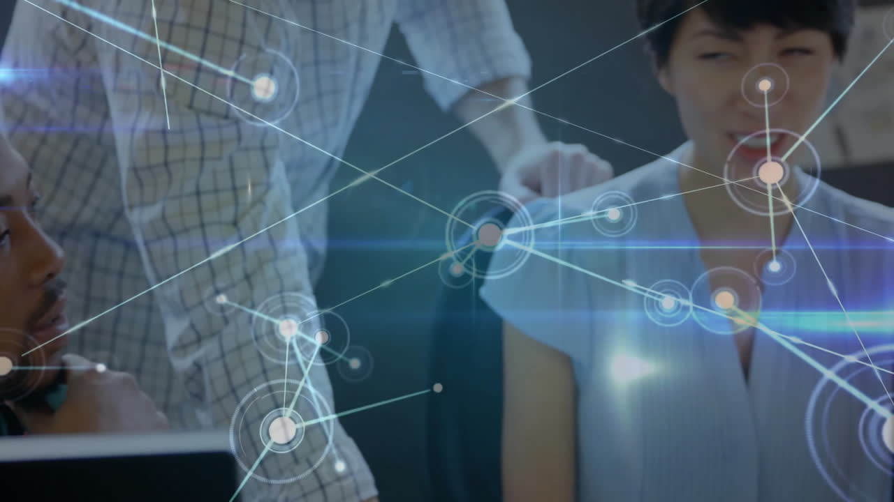 Animation of network processing over happy diverse colleagues talking at casual office