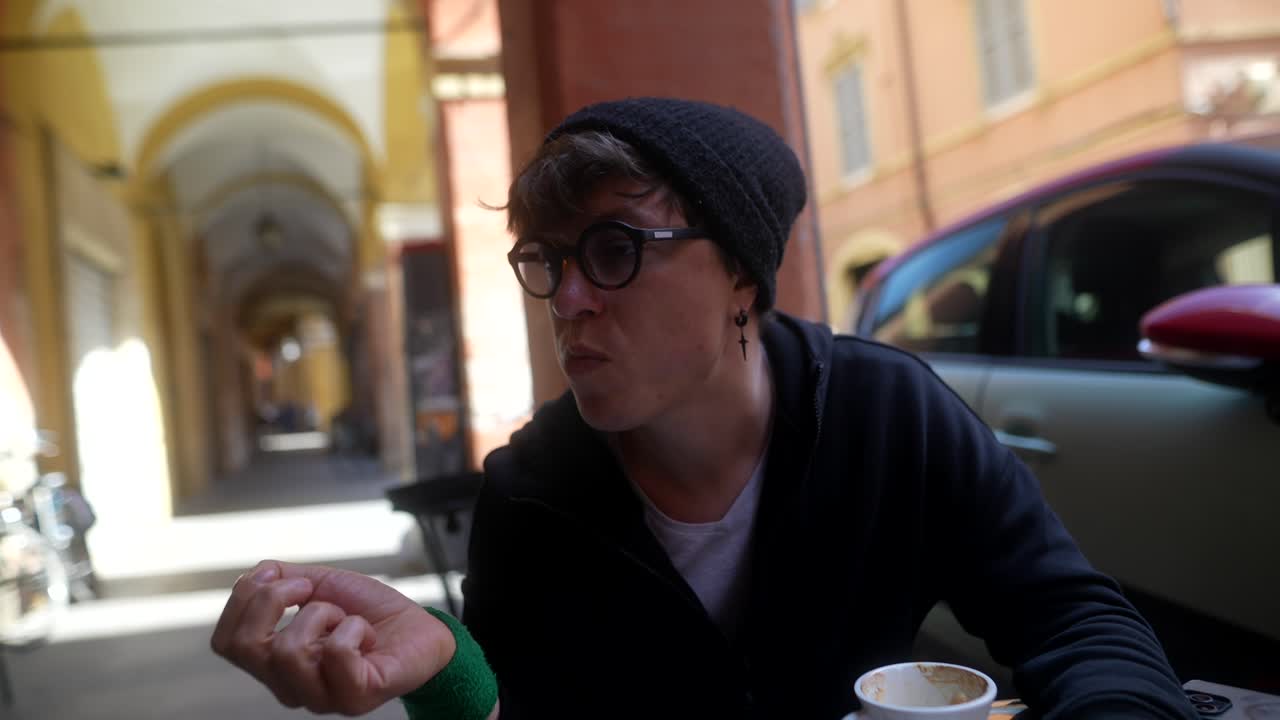 Man enjoying coffee in an Italian street cafe