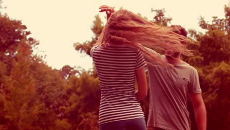 Happy-cute-couple-dancing-in-the-park