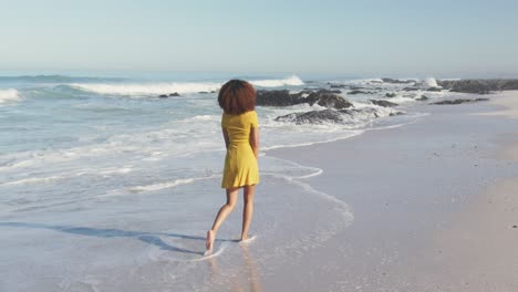 african american woman walking seaside