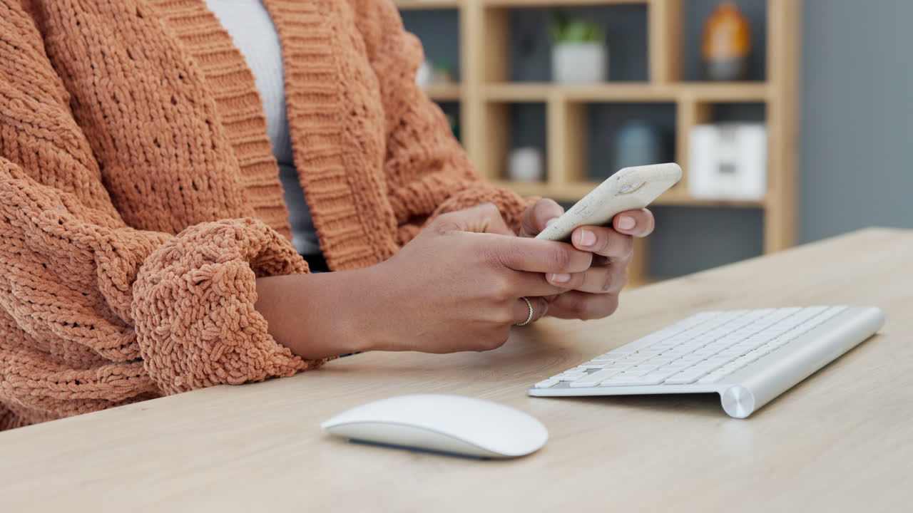 Closeup of the hands of a woman typing