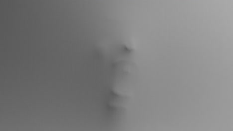 a creepy silhouette of a woman's face appears screaming from the white surface