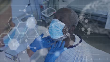 Animation-of-medical-data-over-hands-of-doctor-checking-african-american-patient-in-face-mask