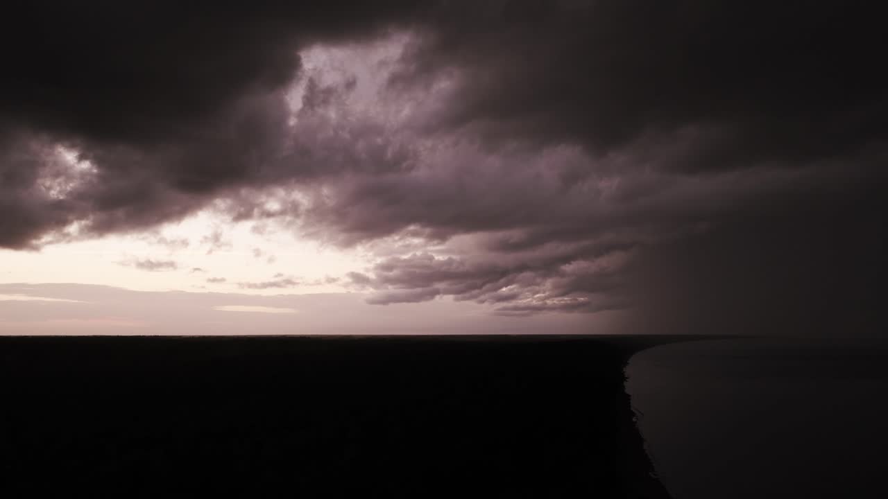 Dark dramatic clouds of coast horizon symbolizing extreme weather global danger