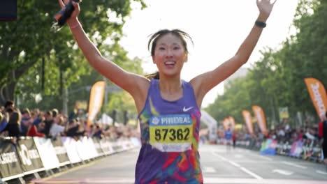 a triumph of spirit and perseverance: celebrating victory at the finish line in a race, capturing the joy and accomplishment of a dedicated athlete