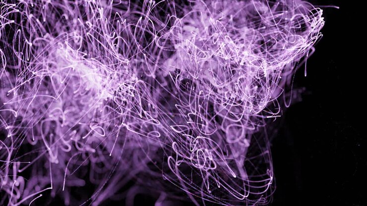 Purple lights trails moving against black background