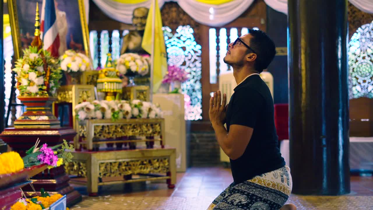 Man Praying in a Thai Temple