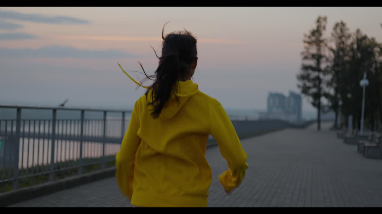 Woman Running in the Park at Sunrise