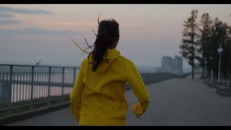 woman running in the park at sunrise